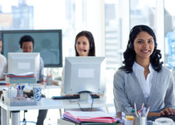 Businesswoman With A Headset On In A Call Center
