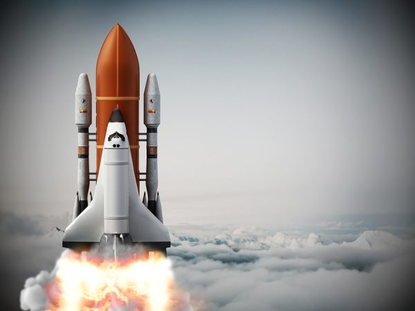 Rocket carrying space shuttle launches off. 3D illustration.