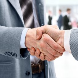 Closeup of handshake as a sign of successful cooperation and int