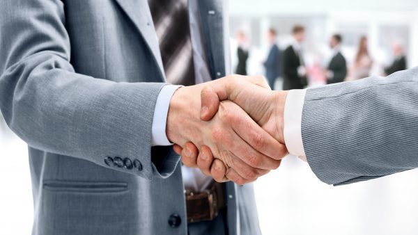 Closeup of handshake as a sign of successful cooperation and int